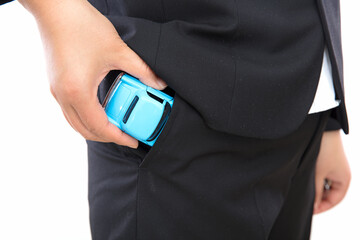 The man in the black suit took the model car out of his pocket