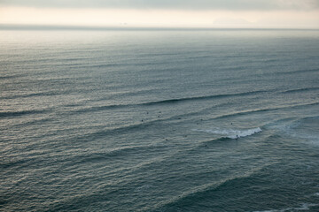 peruvian sea, pacific ocean on the green coast of lima, peru
