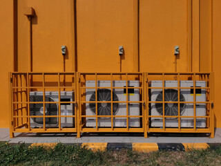 Air conditioner compressor on a yellow background