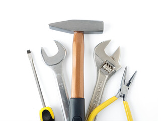 Mechanic equipment set, wrench, adjustable spanner, hammer, pliers and screwdriver isolated on white background.