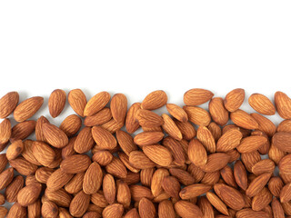 Organic raw peeled almond nuts as background with copy space, top view.  Vegetarian snack or Healthy food concept .