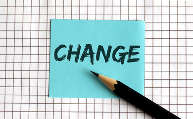 CHANGE , the phrase is written on colored stickers, on a notepad background. Business concept