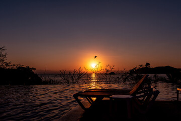 Sunset on the beach of Zihuatanejo Mexico  with a bird flying