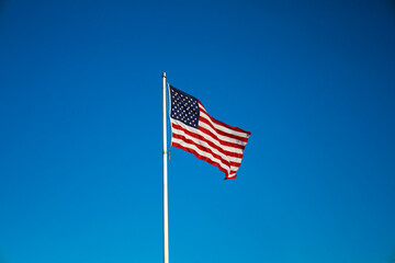 american flag on sky waving in the wind