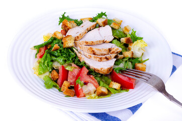Home kitchen. Vegetable salad with chicken and croutons. Caesar. Studio Photo