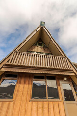 Old lodge contrasts with blue sky