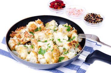 Cauliflower in batter, fried in pan. Studio Photo