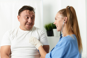 Fototapeta premium female doctor stethoscope patient examination fun treatment