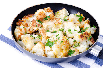 Cauliflower in batter, fried in pan. Studio Photo