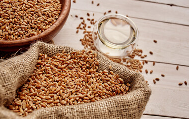 Wheat sprinkled on a wooden board Kitchen spoon