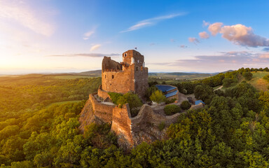 Historical monument in Hungary Mountains. Aerial landscape about a medieval castle ruins near by...