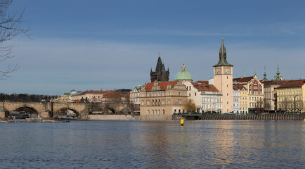 Charles bridge and skyline of Prague's Old Town along the Vltava river