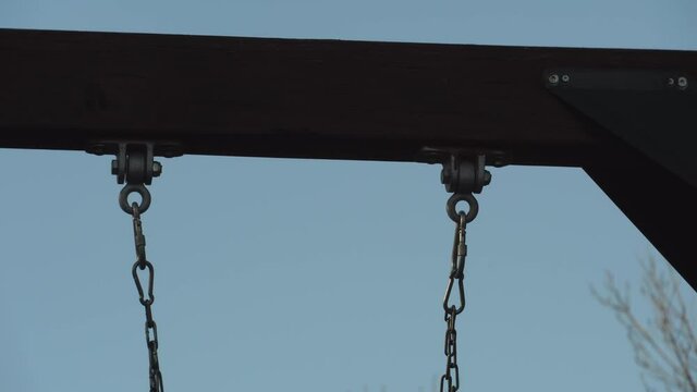 Hinges of a swing set moving 