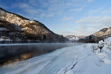 Winter theme at Hallingdalselva. A beautiful river in Hallingdal, Gol is freezing up in the cold February morning.  