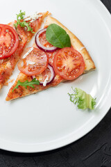 Slices homemade of pizza on a white plate