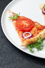 Fototapeta na wymiar Slices homemade of pizza on a white plate