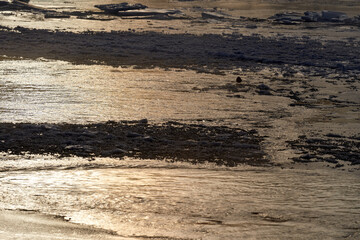 The river is about to freeze. It is very cold and the river is much warmer than the air, therefore the smoke or the damp from the river. Shot at Gol, Norway in February. Minus 20 degreases Celsius. 