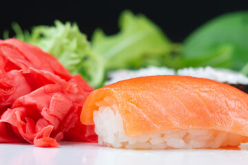 Sushi rolls with rice, herbs and soy sauce, close-up