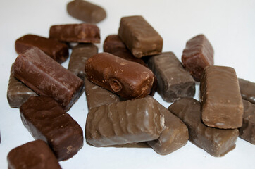 chocolate candies close up on white background