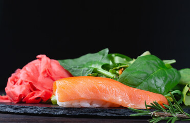 Sushi rolls with rice, herbs and soy sauce, close-up