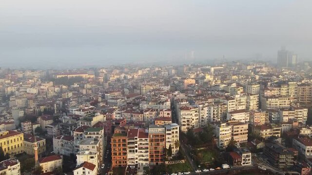 View of residential areas in Istanbul, Turkey. Smoke on the horizon, camera movement from the bottom up. High quality FullHD footage