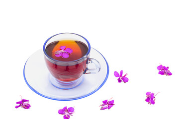 Ivan tea drink in a glass cup. On a white background pink flowers of Ivan tea.