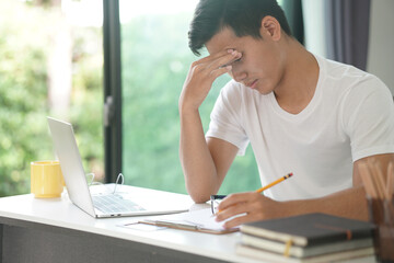 asian young teenage student man teenager entrepreneur studying working hard feeling stressed tired exhausted bored. - obrazy, fototapety, plakaty