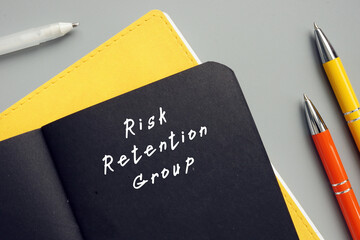 Financial concept about Risk Retention Group with phrase on the sheet.