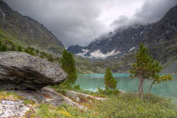 Fototapeta na wymiar Mountain landscape. Mountain lake, mountains with glaciers.