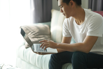 asian young student man entrepreneur working with computer studying learning online at home....