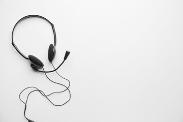 Headphones with microphone on white background