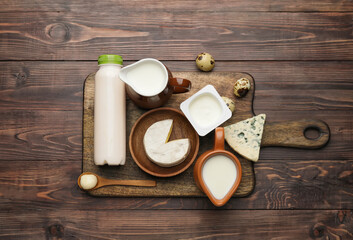 Different dairy products without lactose on wooden background