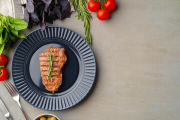 Grilled beef steak served on blue plate