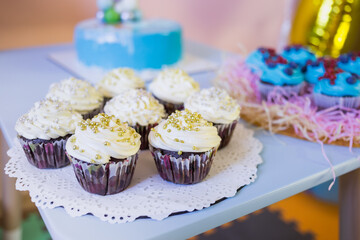 Homemade cupcakes on the background of a children's holiday - birthday.