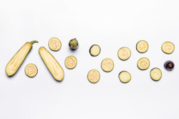 Eggplant pieces on white background
