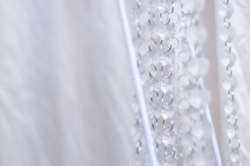 Crystal chandelier. Big classic crystals. Low angle shot of a big beautiful crystal luxury chandelier. With bling bling shining reflection.