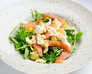 Salad - smoked salmon with vegetables and grapes. Delicious unique recipe, healthy salad for dinner.