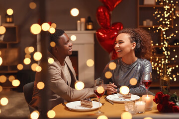 Obraz na płótnie Canvas African-American couple celebrating Valentine's Day at home