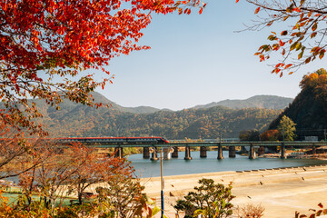 Railroad with Miryang river and mountain at autumn in Miryang, Korea