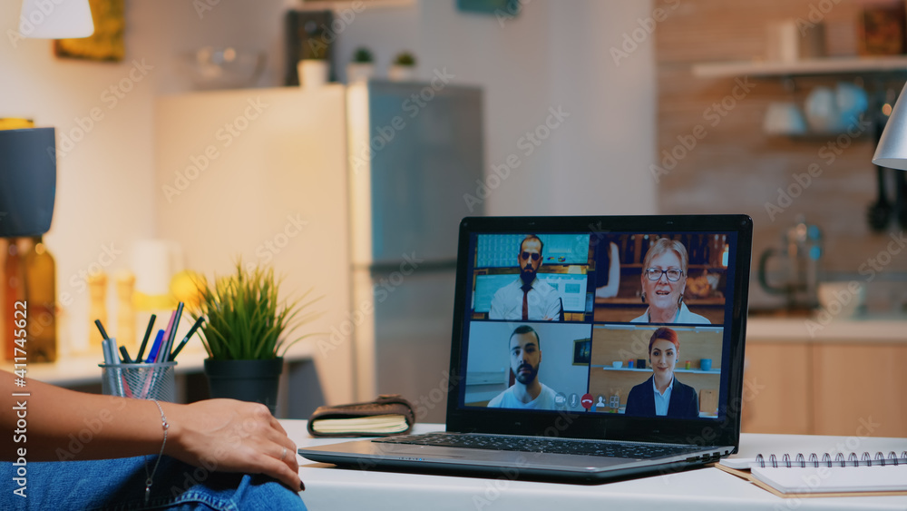 Poster business woman having webinar studying from home using internet technology on laptop in midnight. la