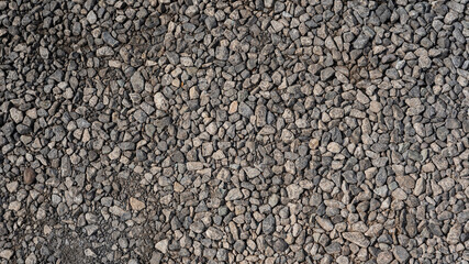 close up small cube stone on road full background
