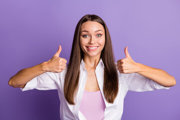 Photo of young happy positive lovely pretty attractive smiling woman showing thumb-up isolated on violet color background