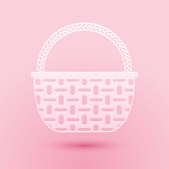 Paper cut Shopping basket icon isolated on pink background. Online buying concept. Delivery service sign. Shopping cart symbol. Paper art style. Vector.