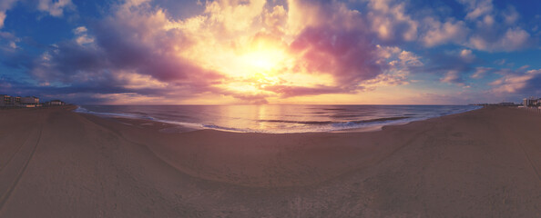 Seascape in the early morning. Sunrise over the sea. Nature landscape with dramatic sky. Horizontal panorama
