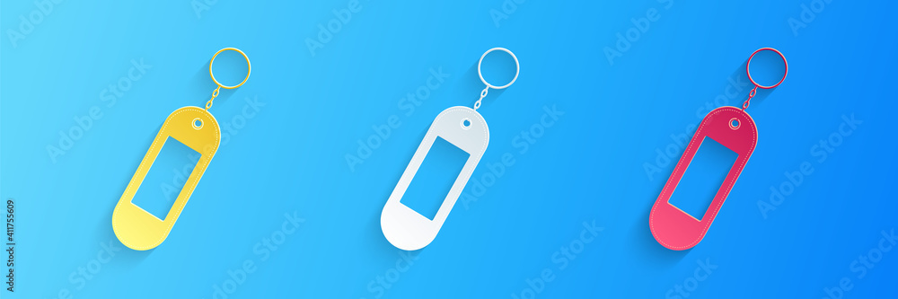 Poster paper cut key chain icon isolated on blue background. blank rectangular keychain with ring and chain
