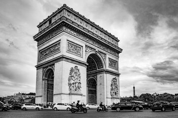 Fototapeta na wymiar Paris, France - July 18, 2019: Black and white photograph of Arc de Triomphe de l'Ã‰toile (French, 