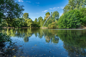 Fototapeta premium View over the pond of the park in Sterkrade, Oberhausen, North Rhine-Westfalia, Germany