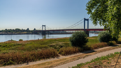 Fototapeta na wymiar View over the River Rhine with the Friedrich-Ebert-Bridge, seen in Duisburg-Homberg, North Rhine-Westfalia, Germany