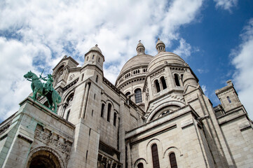 Fototapeta na wymiar Paris, France - July 19, 2019: The facade and cupola of the Basilica of the Sacred Heart (SacrÃ© Coeur) in Paris, France