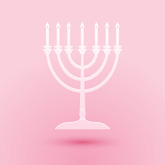 Paper cut Hanukkah menorah icon isolated on pink background. Religion icon. Hanukkah traditional symbol. Holiday religion, jewish festival of Lights. Paper art style. Vector.